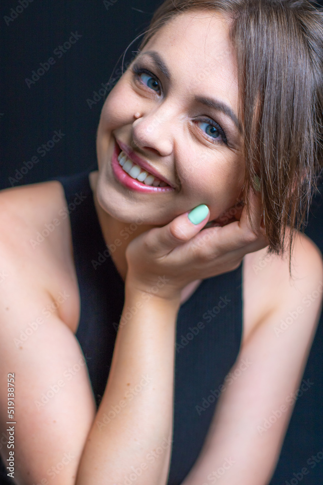 Woman portrait with face in hands. Portrait Beautiful Girl on black background. Girl with Woman portrait with face in hands. Portrait Beautiful Girl on black background. Girl with