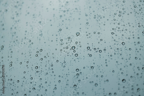 Drops on wet glass, rain outside the window.