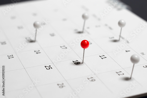 Close-up of the calendar pushing red and white pins. appointment reminder planning ideas © bancha