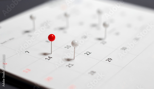 Close-up of the calendar pushing red and white pins. appointment reminder planning ideas