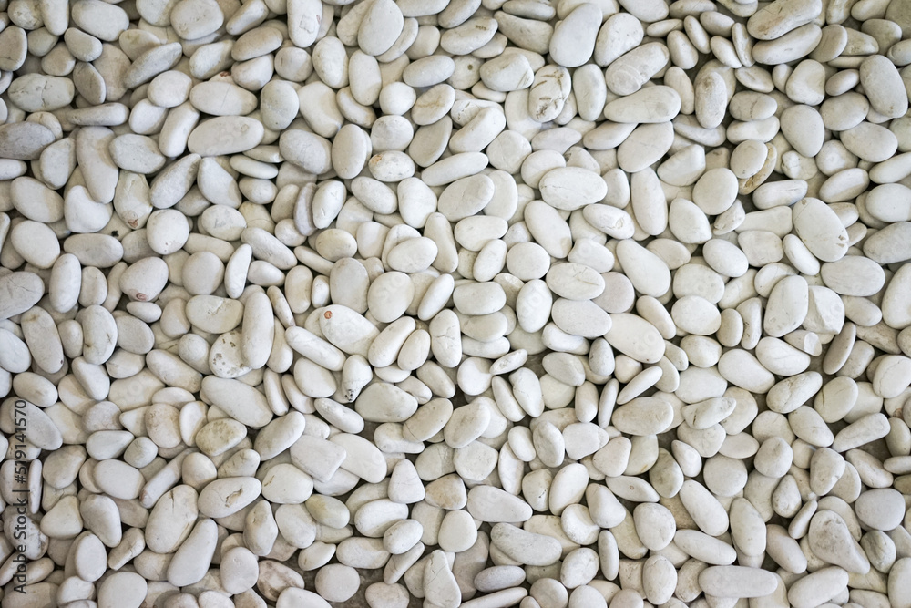 White stone background (texture). White river grit stones background. Marbled white gravel. Crushed stone texture. White stone background (texture). White river grit stones background. Marbled white gravel. Crushed stone texture.