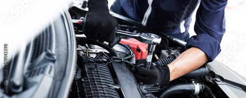 Automobile mechanic repairman hands repairing a car engine automotive workshop with a wrench, car service and maintenance , Repair service © A Stockphoto