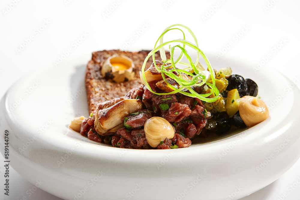 Beef tartare with greenery closeup view Beef tartare with greenery closeup view