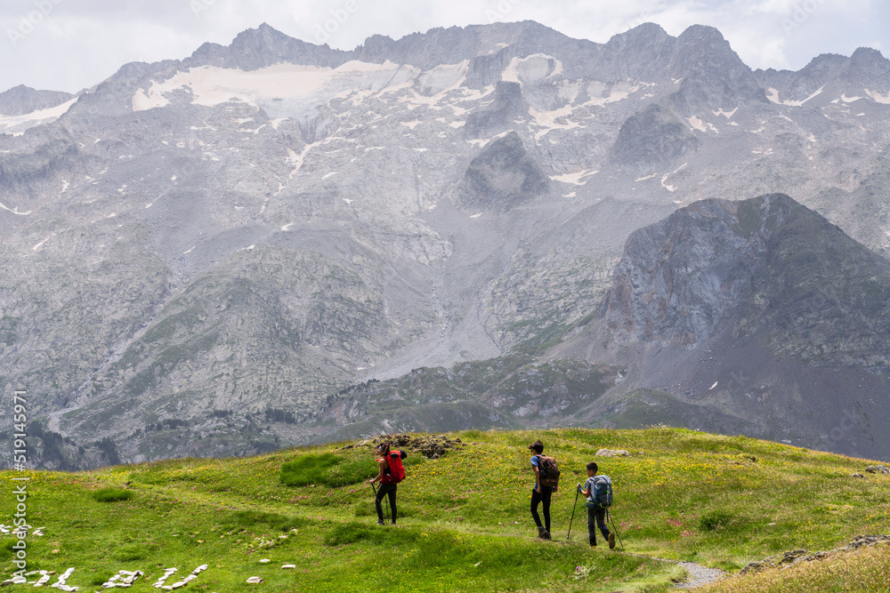 walking in front of the Maladeta massif, route to France through the Portillon pass, Benasque Valley, Huesca, Pyrenean mountain range, Spain walking in front of the Maladeta massif, route to France through the Portillon pass, Benasque Valley, Huesca, Pyrenean mountain range, Spain