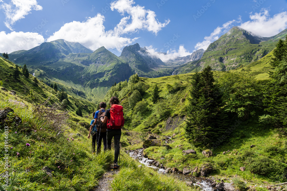 hikers on the trail, Ascending towards Hourgade Peak, L´Ourtiga, Luchon, Pyrenean mountain range, France