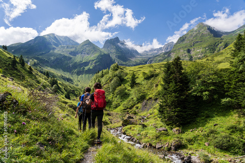 hikers on the trail, Ascending towards Hourgade Peak, L´Ourtiga, Luchon, Pyrenean mountain range, France