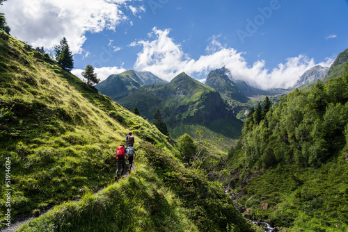 hikers on the trail, Ascending towards Hourgade Peak, L´Ourtiga, Luchon, Pyrenean mountain range, France