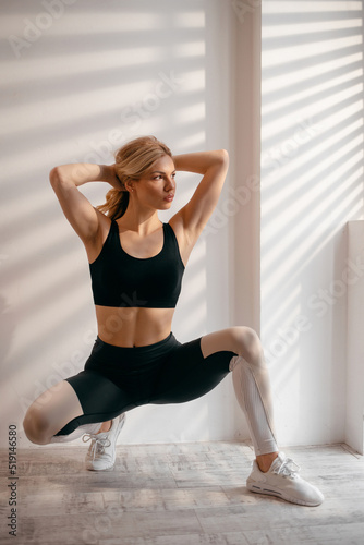 Athletic european woman enjoy sunlight indoors