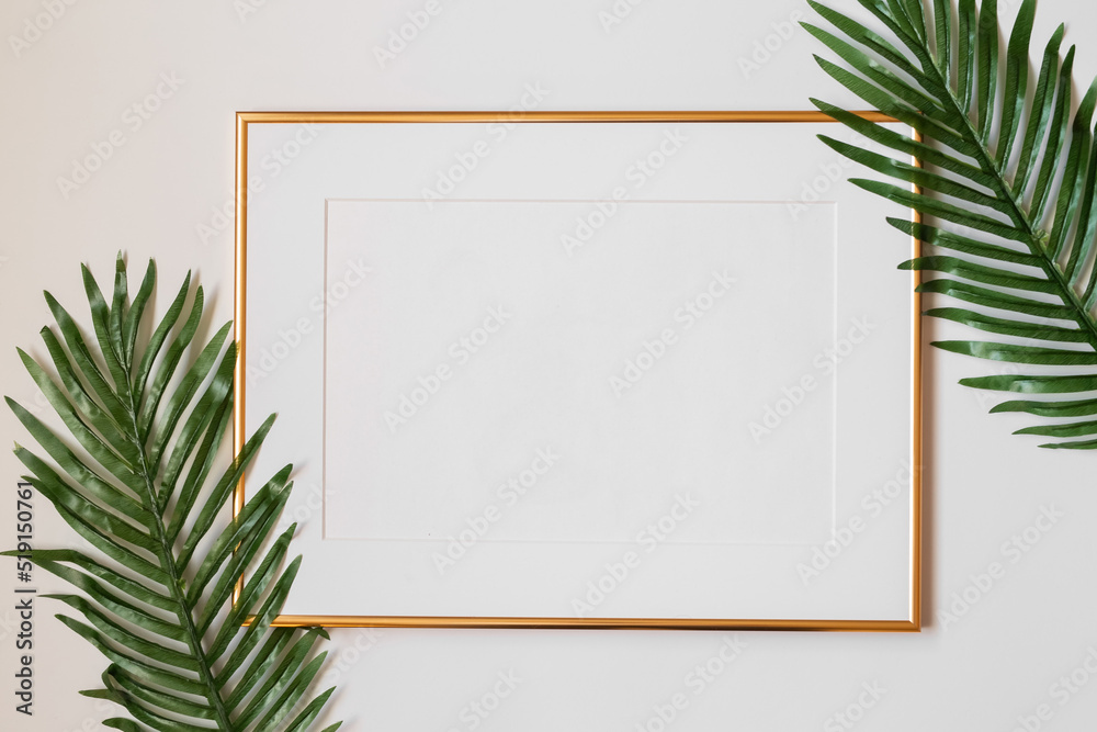 Mock up poster. Minimal template with empty picture frame mock up. White background with plants Mock up poster. Minimal template with empty picture frame mock up. White background with plants