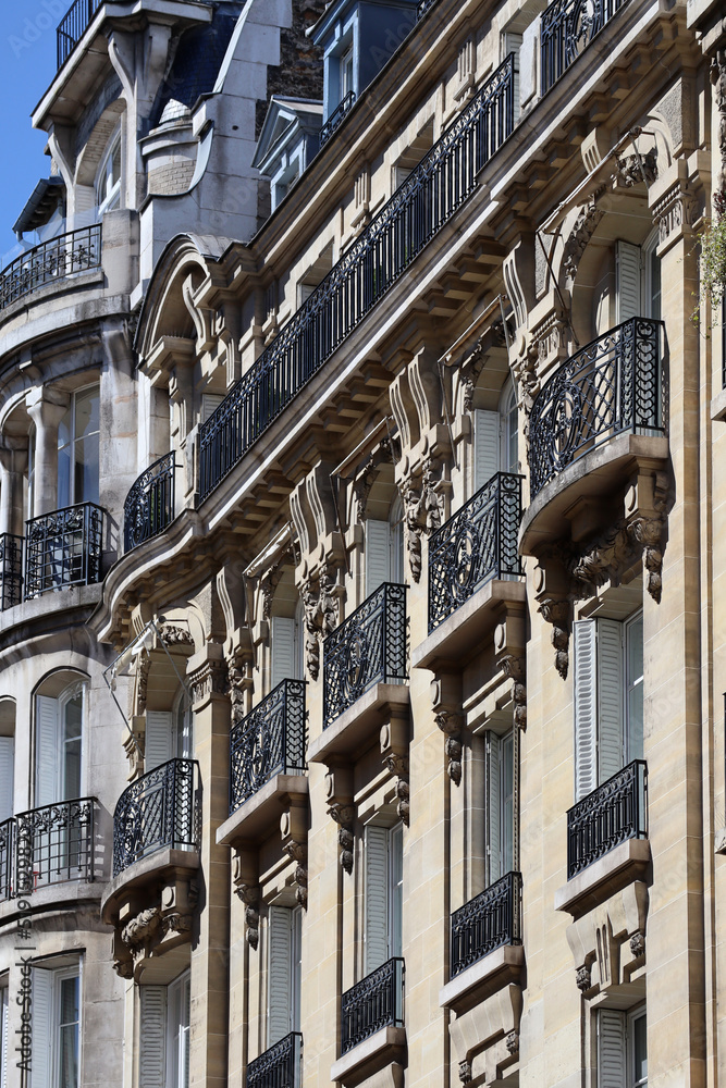Naklejka premium Typical Parisian building facade of the 19th century, in the Haussmann style