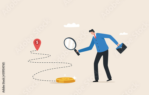 Financial navigation. Path to financial success. Earning extra income or increasing salary.  Businessman holding a magnifying glass to search and track the trace of money.