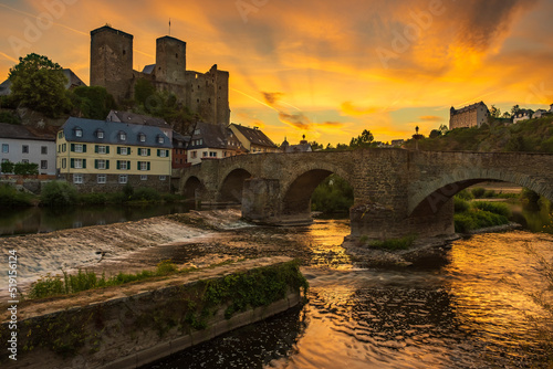View over the Lahn in Runkel/Germany towards the old stone bridge and the castle at a beautiful sunset