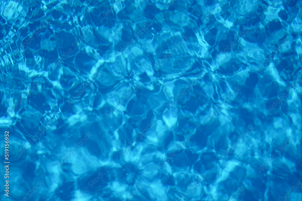 Wavy water surface of swimming pool, top view