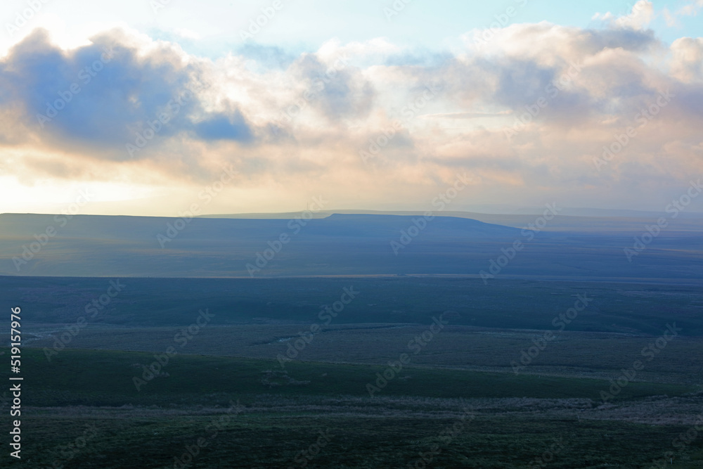 Dramatic Lighting over the Pennine Hills at Sunset, North Yorkshire, UK England.