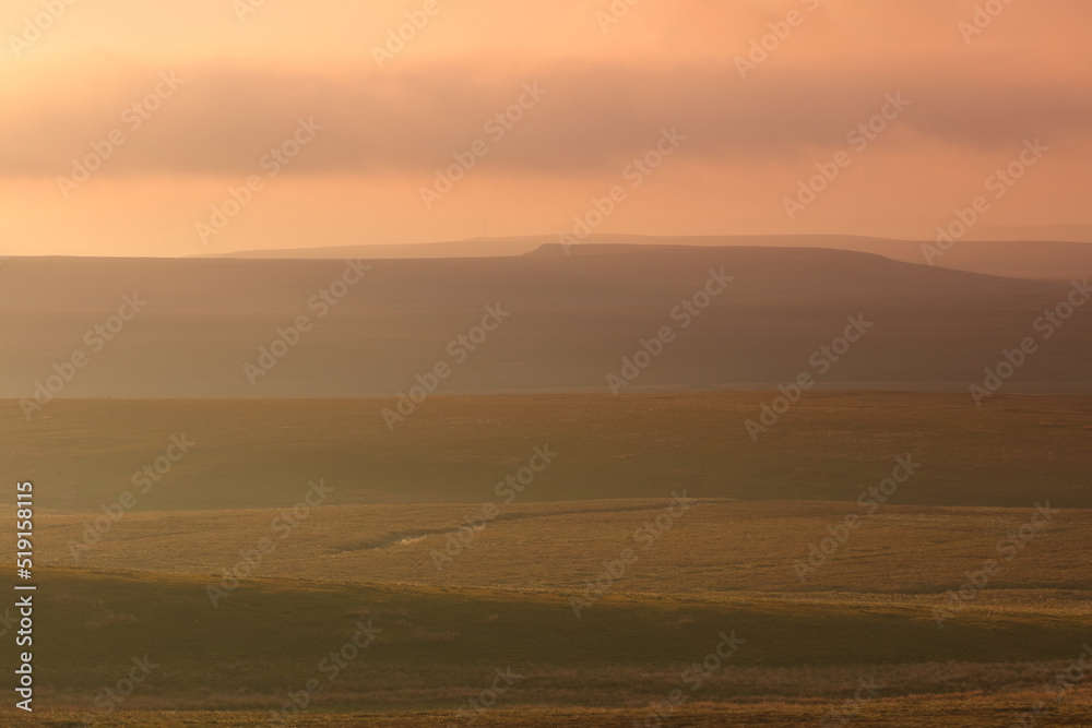 Dramatic Lighting over the Pennine Hills at Sunset, North Yorkshire, UK England. Dramatic Lighting over the Pennine Hills at Sunset, North Yorkshire, UK England.