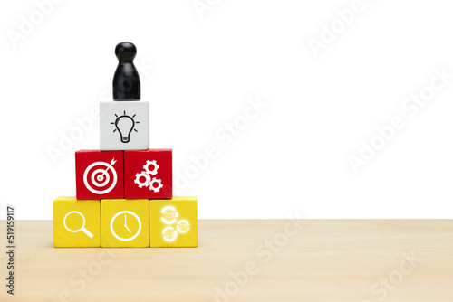 Leadership is essential for teamwork in business.  Icon business on wooden cube photo