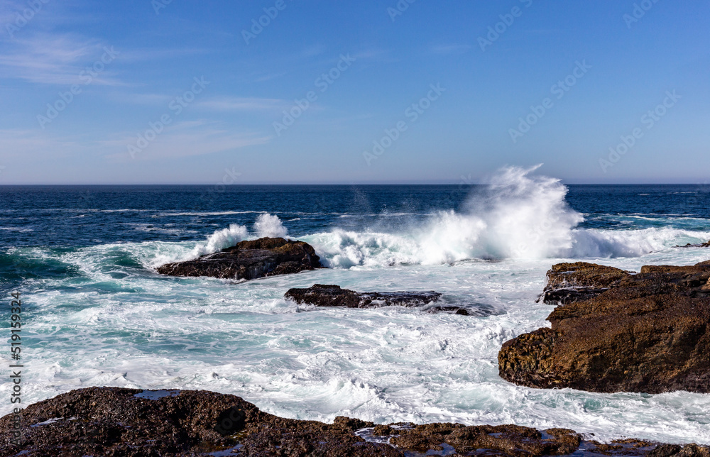 A view on Pacific ocean, cast, rocks and waves