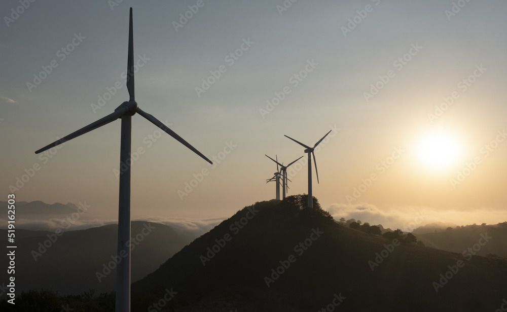 Obraz premium Wind turbine farm at sunset in Navarra, Spain
