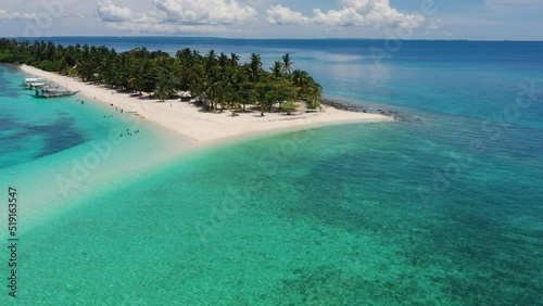 Flying Over The Turquoise Beach Waters And Visible Sandbank Of Kalanggaman Island In The Philippines. Forward Aerial Shot photo