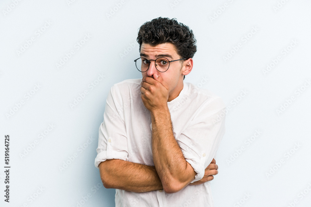 Young caucasian man isolated on blue background scared and afraid. Young caucasian man isolated on blue background scared and afraid.