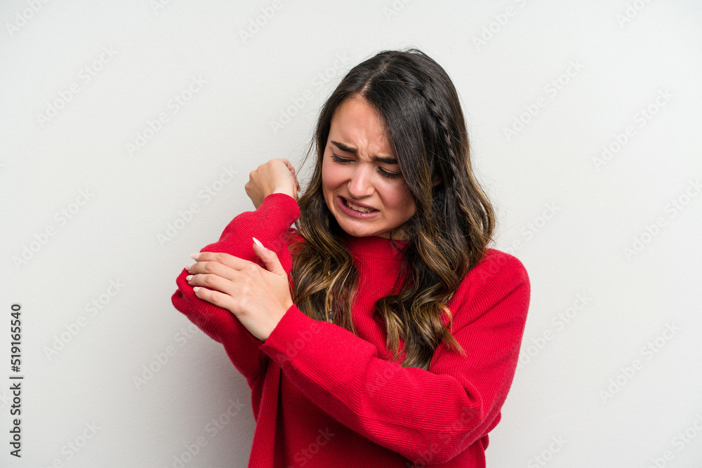 Young caucasian woman isolated on white background massaging elbow, suffering after a bad movement. Young caucasian woman isolated on white background massaging elbow, suffering after a bad movement.