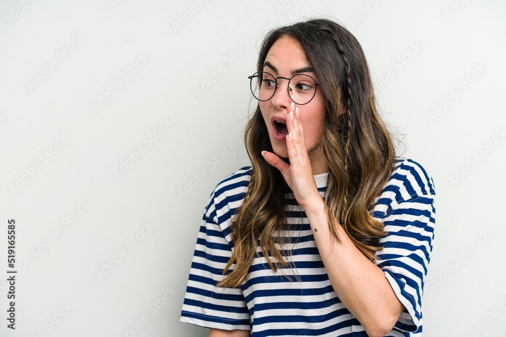 Young caucasian woman isolated on white background being shocked because of something she has seen. Young caucasian woman isolated on white background being shocked because of something she has seen.