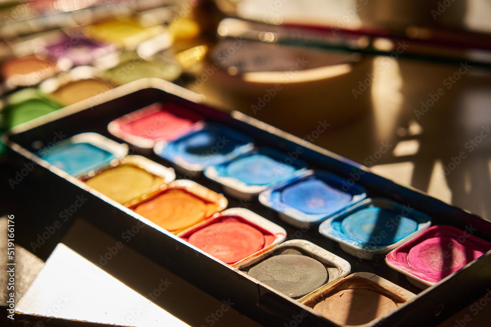watercolor paints are laid out on the table watercolor paints are laid out on the table