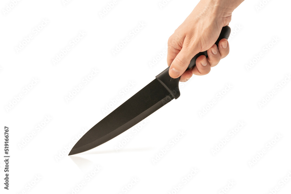 Knife in male hand isolated on white background. Kitchen knife in the hand of the chef. Copy space. Knife in male hand isolated on white background. Kitchen knife in the hand of the chef. Copy space.