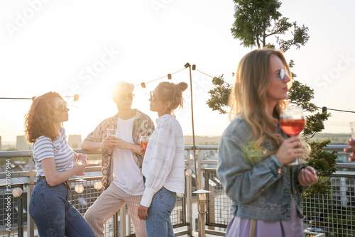 Sticker Group of caucasian friends at the party in top of the roof