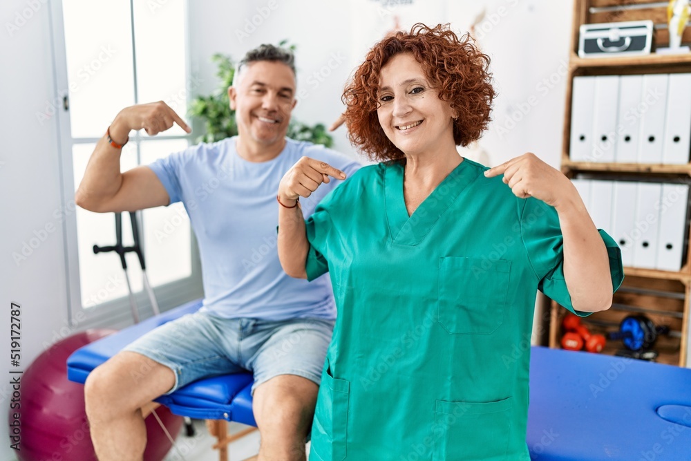 Fototapeta premium Physiotherapy woman working at pain recovery clinic with patient looking confident with smile on face, pointing oneself with fingers proud and happy.