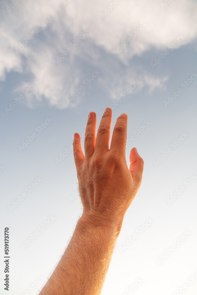 male hand reaching out in summer male hand reaching out in summer