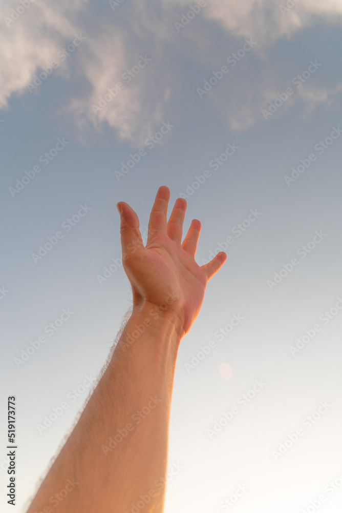 male hand reaching out in summer male hand reaching out in summer