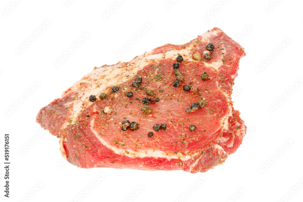 Marinated meat with spices on a white background.