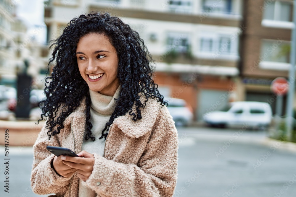 Young hispanic woman smiling confident using smartphone at street Young hispanic woman smiling confident using smartphone at street