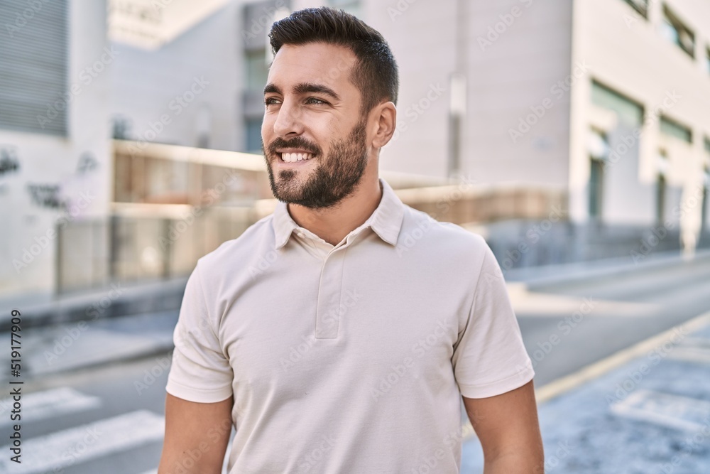Young hispanic man smiling confident walking at street Young hispanic man smiling confident walking at street