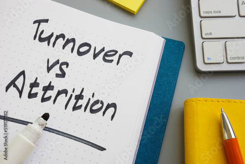 Turnover vs attrition words in the notepad and marker. photo