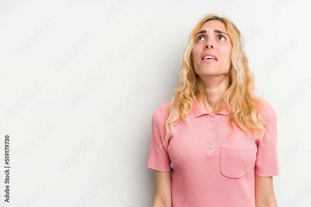 Young caucasian woman isolated on white background shouting very angry, rage concept, frustrated. Young caucasian woman isolated on white background shouting very angry, rage concept, frustrated.