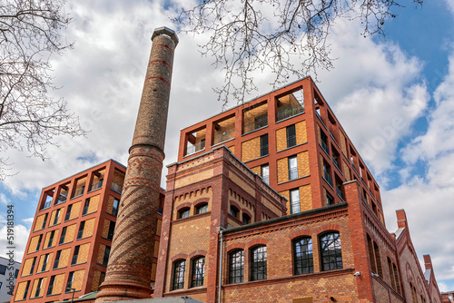 Die historischen Fassaden und Gebäudeteile des ehemaligen Elektrizitätswerkes mit neu errichteten Wohntürmen in der Voltastraße im Frankfurter Stadtteil Bockenheim photo