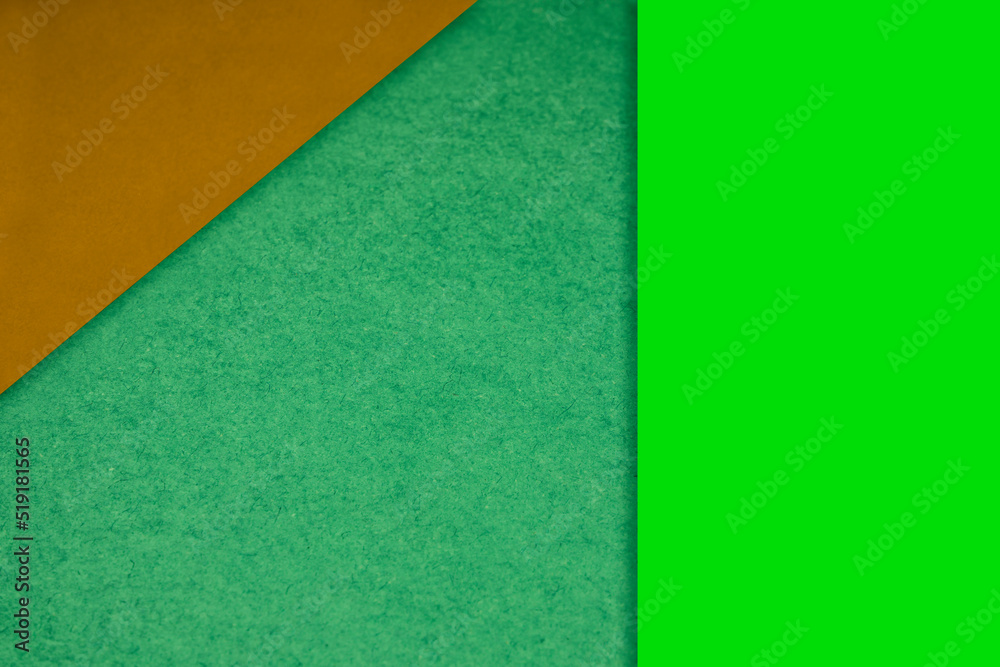 Textured and plain orange neon green sheet papers forming two triangles and vertical blank rectangle for creative cover designing Textured and plain orange neon green sheet papers forming two triangles and vertical blank rectangle for creative cover designing