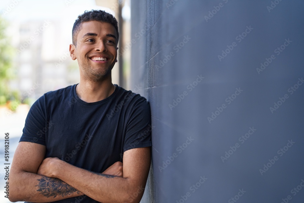 African american man smiling confident standing with arms crossed gesture at street African american man smiling confident standing with arms crossed gesture at street