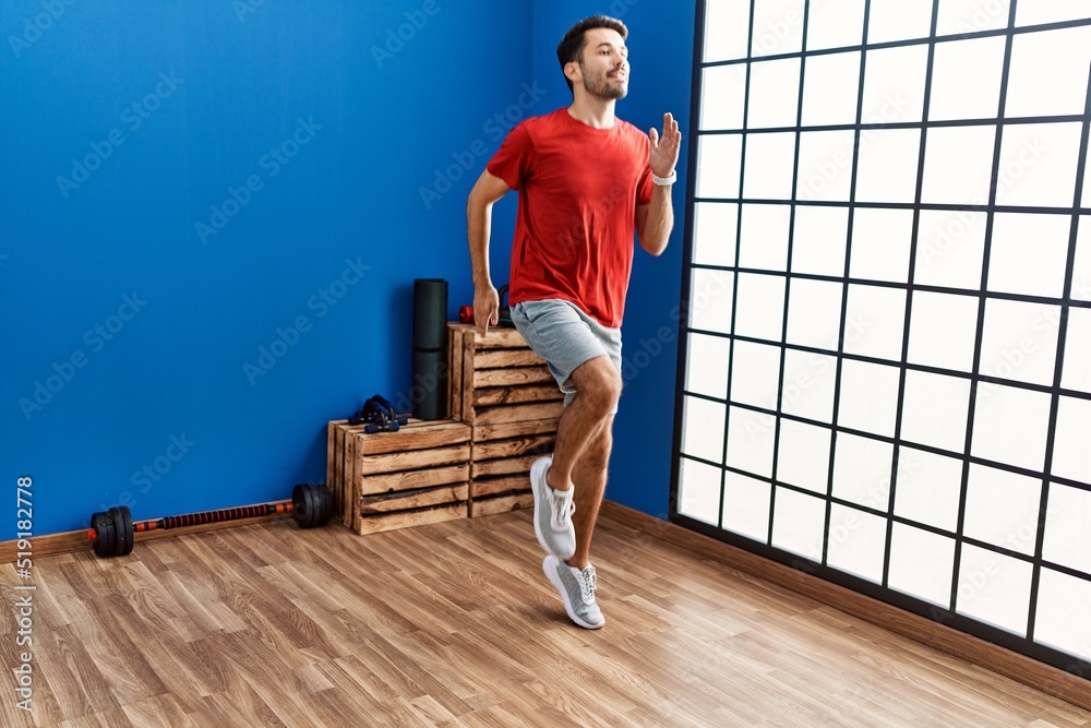 Young hispanic man smiling confident training at sport center Young hispanic man smiling confident training at sport center