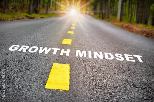 Growth mindset with sunbeam on road surface. Journey to self development to success concept and challenge idea
