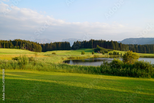 hiking trail overlooking scenic Attlesee in the Bavarian Alps, Nesselwang, Allgaeu or Allgau, Germany