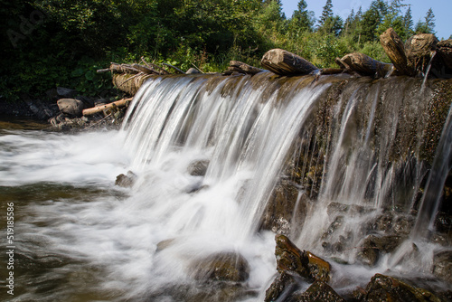 Fototapeta Naklejka Na Ścianę i Meble -  waterfall in the mountains in summer