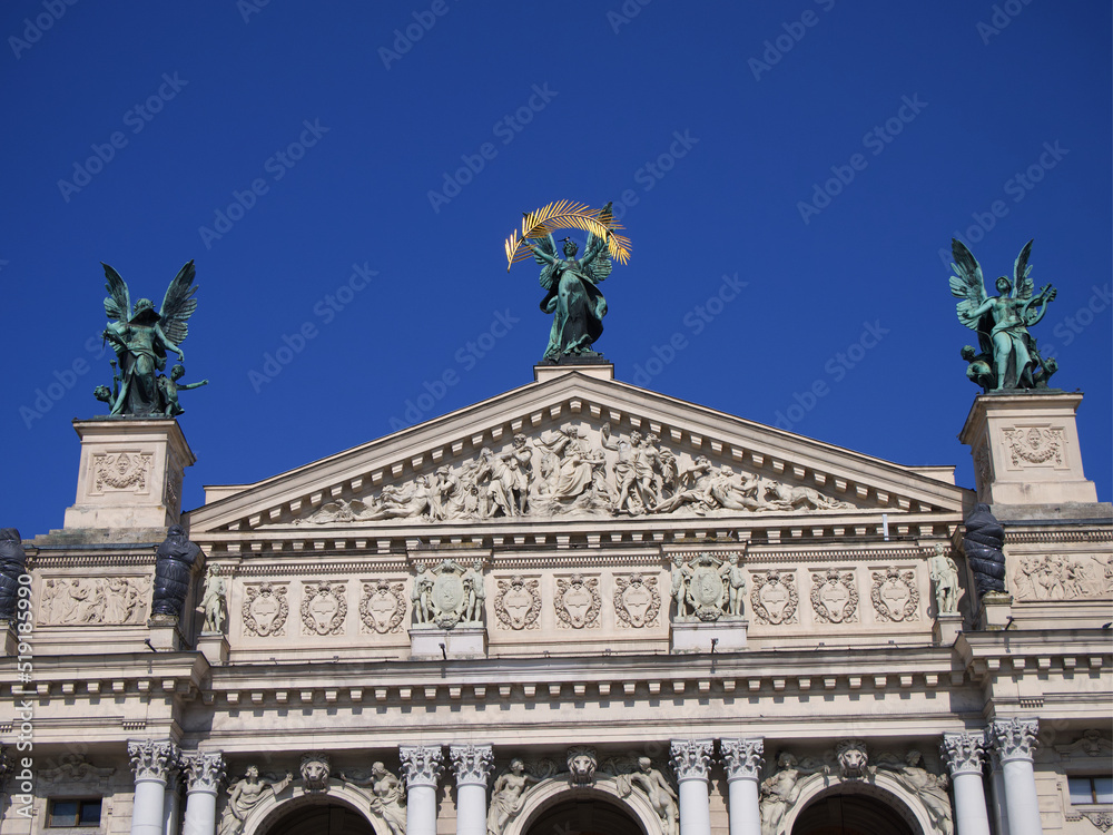 Fototapeta premium Decorated with sculptures and bas-reliefs, the upper part of the facade of the Lviv Opera building. Some of the sculptures are protected from damage and erosion.