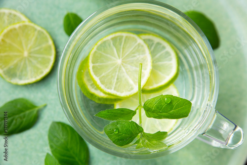 Detox water with mint leaves and lime. Healthy food rich in vitamins and antioxidants. © Marina
