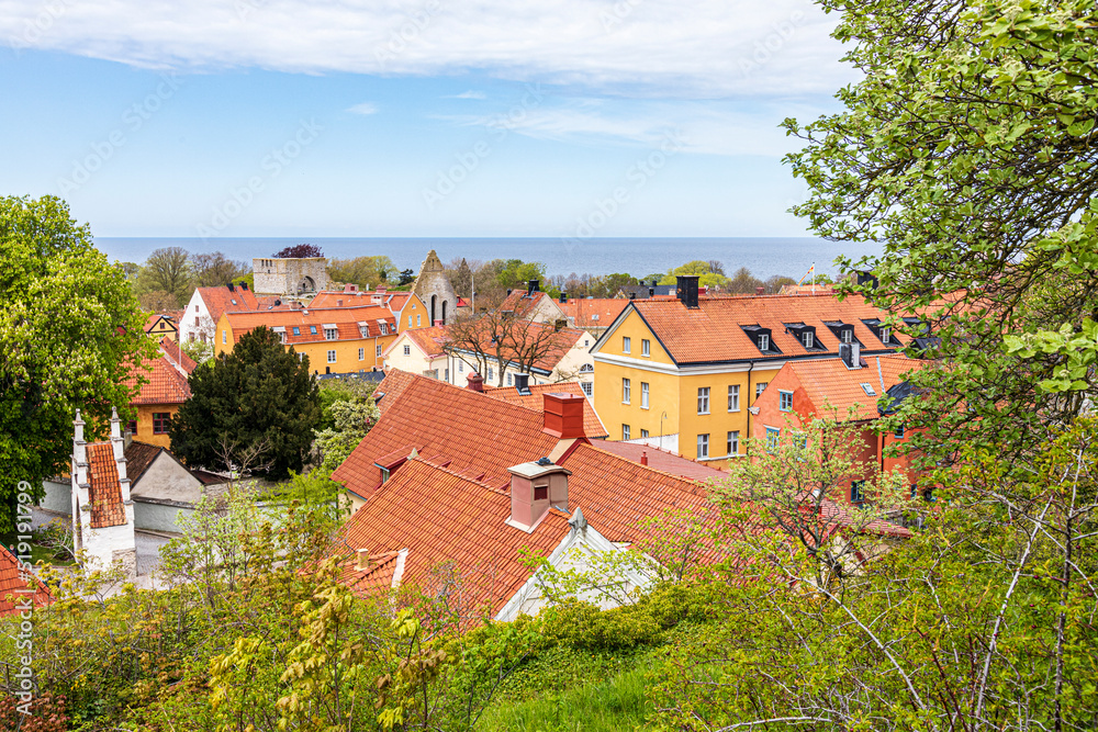 The ruins of St Clemens church (Sankt Clemens kyrkoruin) seen across the rooves of the medieval town of Visby on the island of Gotland in the Baltic Sea off Sweden