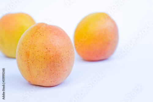 Apricot fruits isolated on white background.