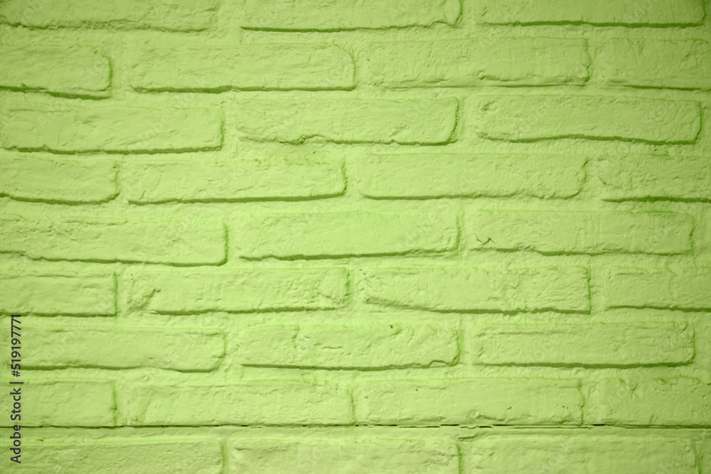 Obraz premium Stone texture background. Closeup of a green brick wall texture. Abstract brick stones pattern background concept, retro layout, interior design and wall banner.