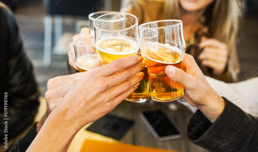 Friends showing hands while holding glasses of beer and cheering with each other - Lifestyle concept Friends showing hands while holding glasses of beer and cheering with each other - Lifestyle concept